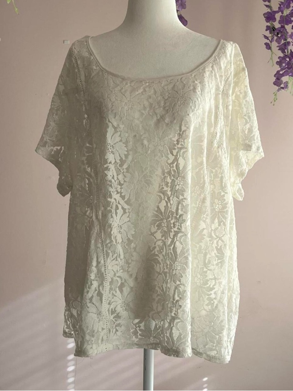 white see through lace top with short flowy sleeves and a flowy fit